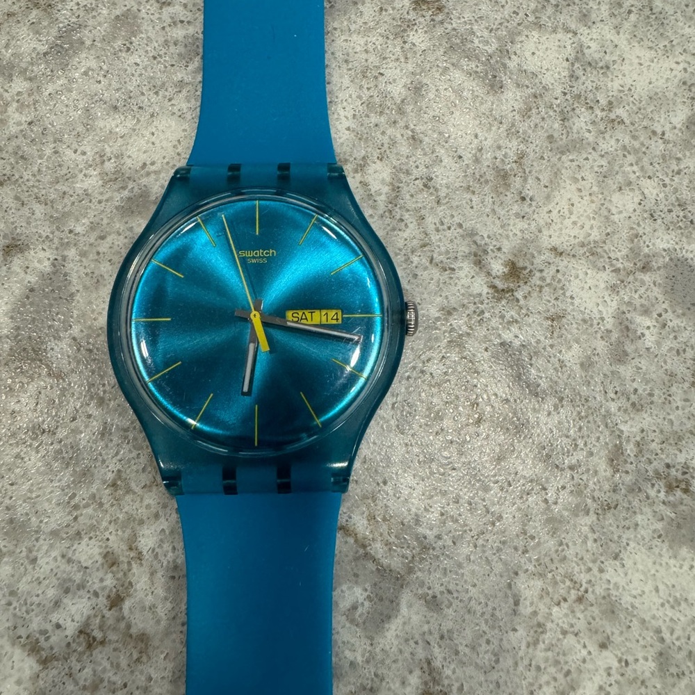 SWATCH watch - Bright blue band with gold  hour indicators; Day & Date se…